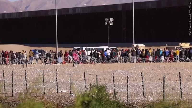 Line of migrants at the U.S.-Mexico border